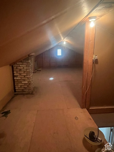 Additional living space featuring vaulted ceiling