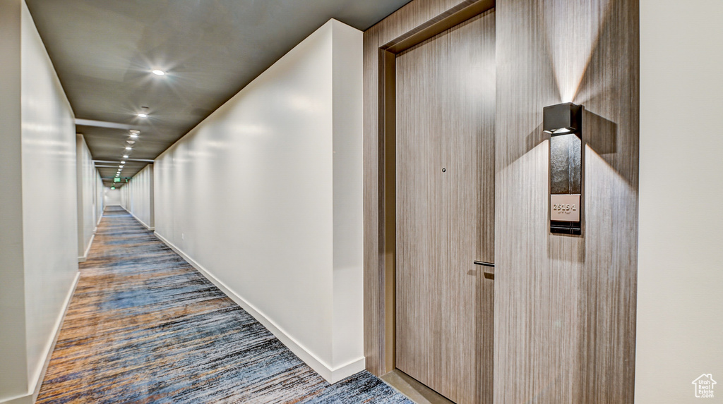 Hall featuring carpet flooring and recessed lighting