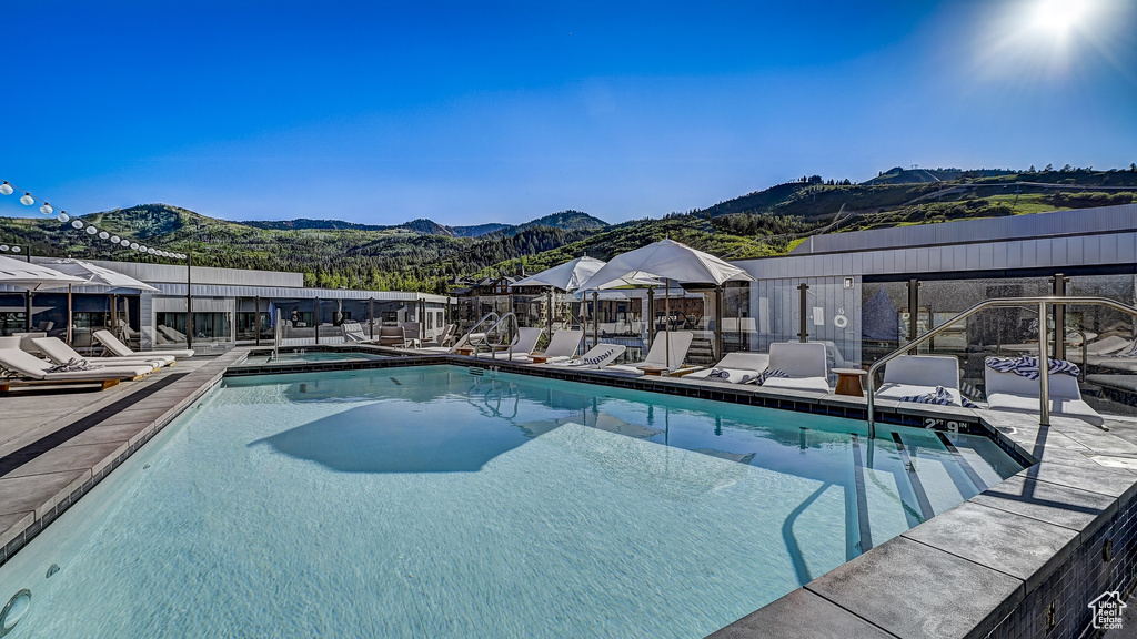 Community pool with a mountain view