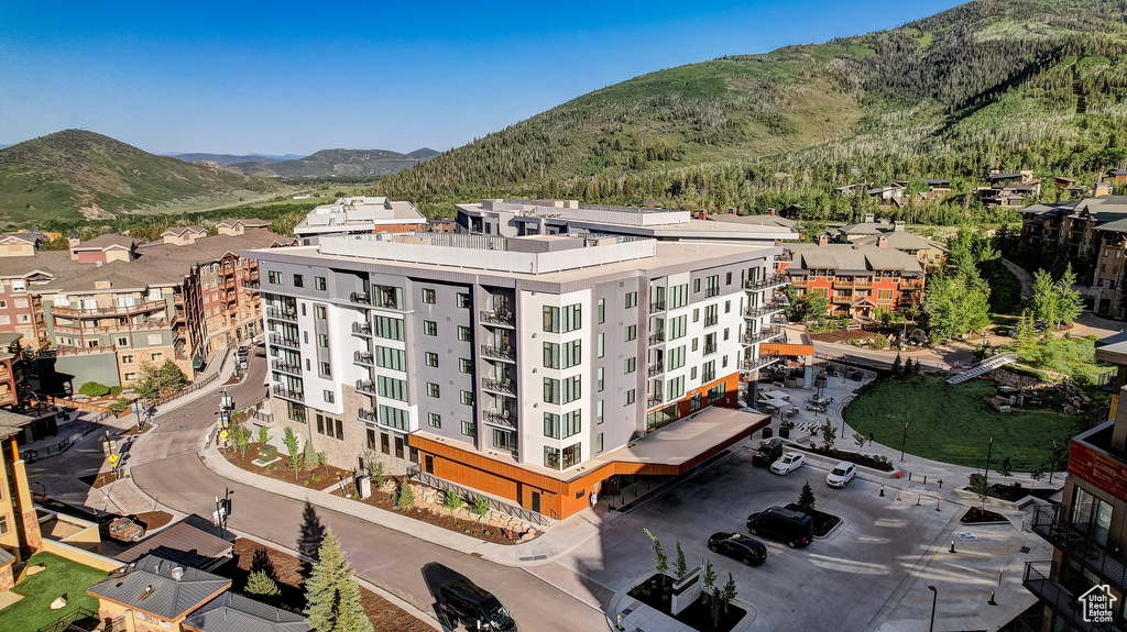Bird\'s eye view of a mountain backdrop and apartment complex