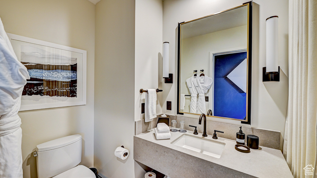 Bathroom with toilet and vanity