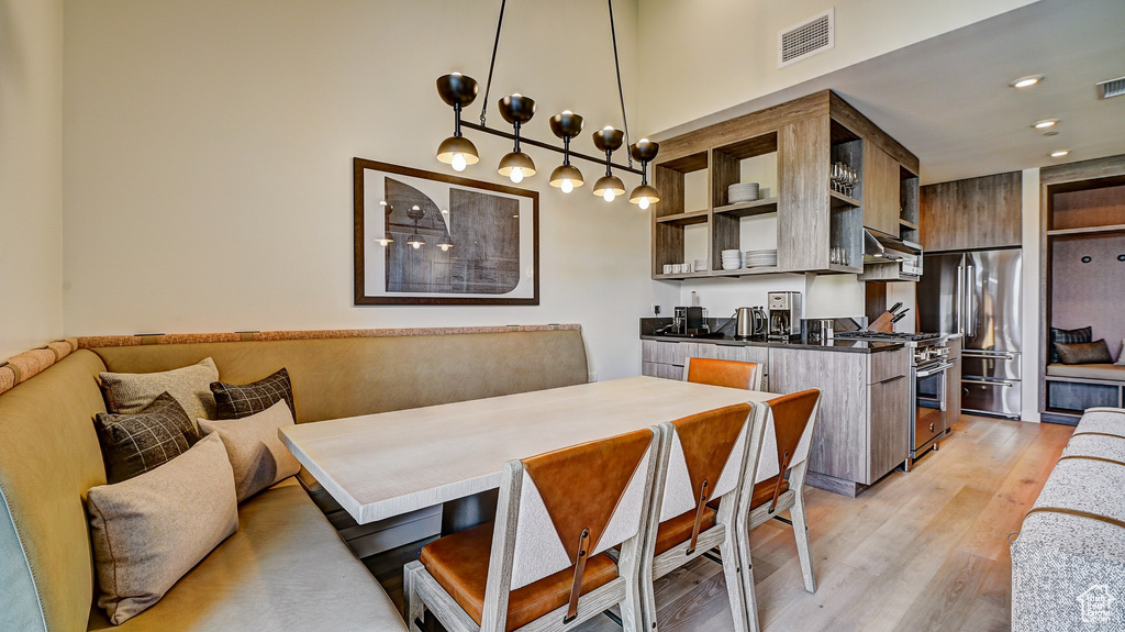 Dining room featuring light wood-style floors and recessed lighting