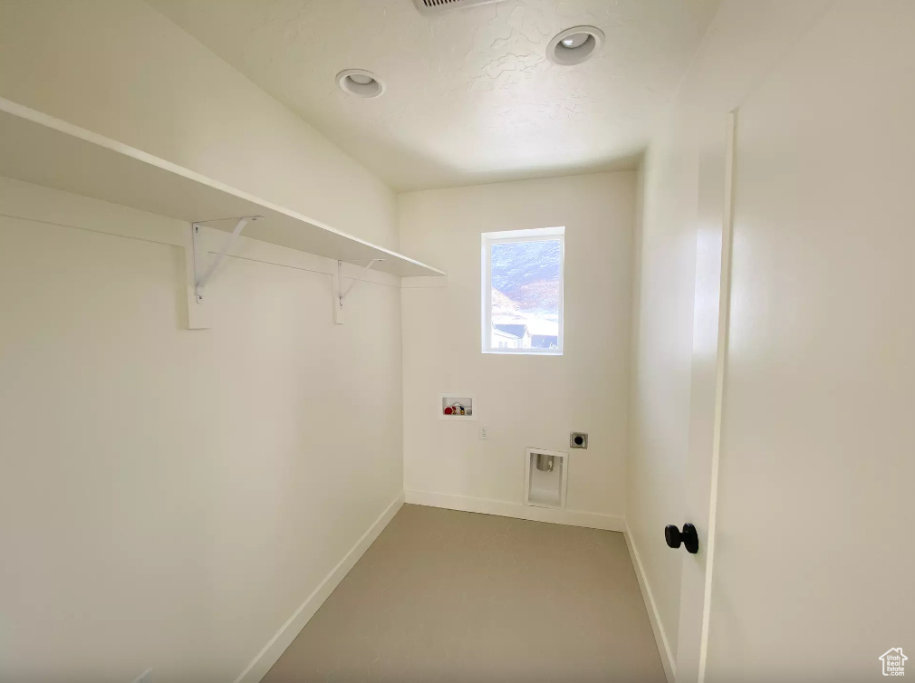 Laundry area featuring hookup for a washing machine, hookup for an electric dryer, and recessed lighting