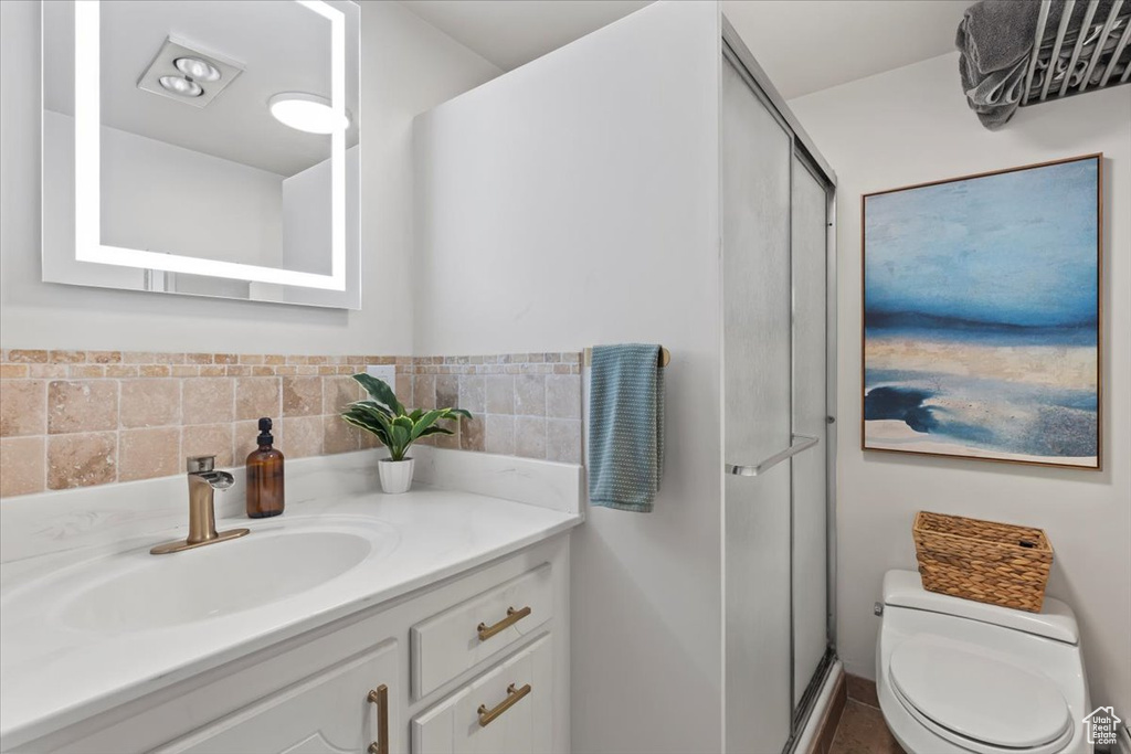 Bathroom with vanity and a shower stall