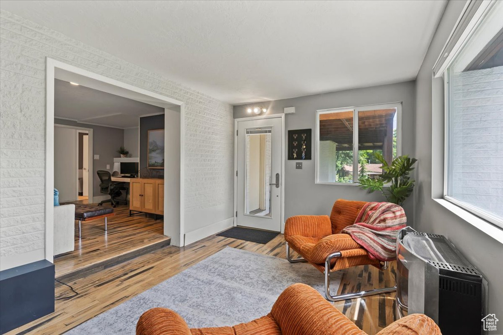 Living room featuring wood finished floors and a desk