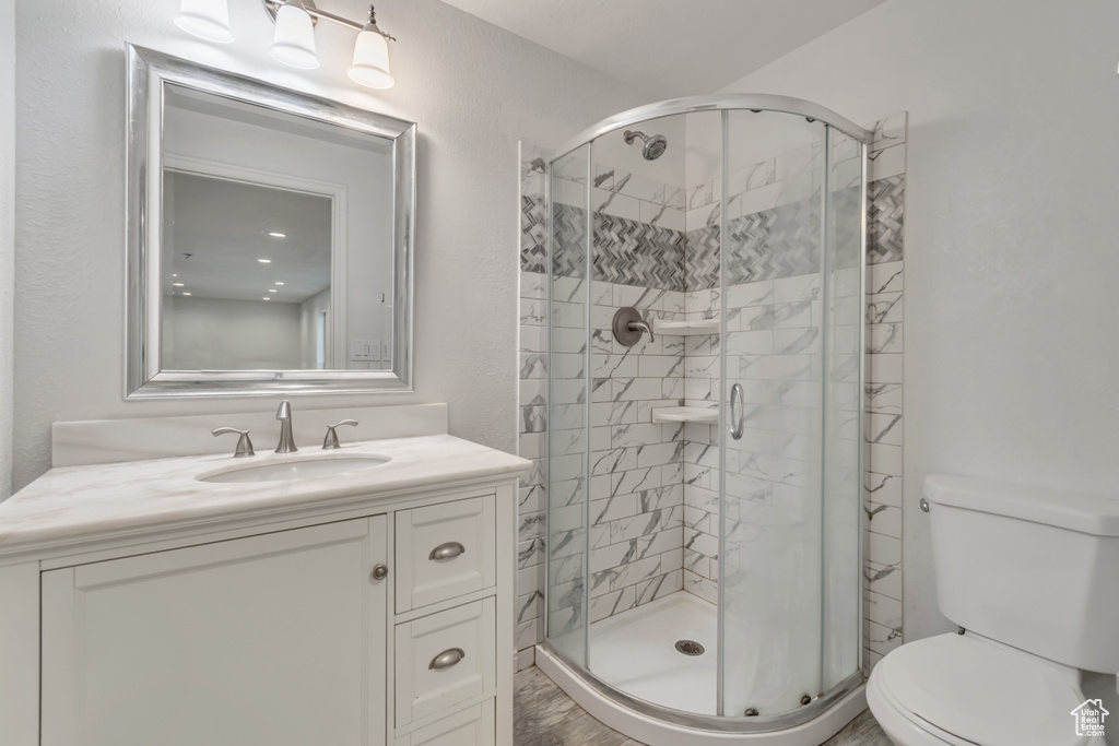 Bathroom with vanity and a shower stall