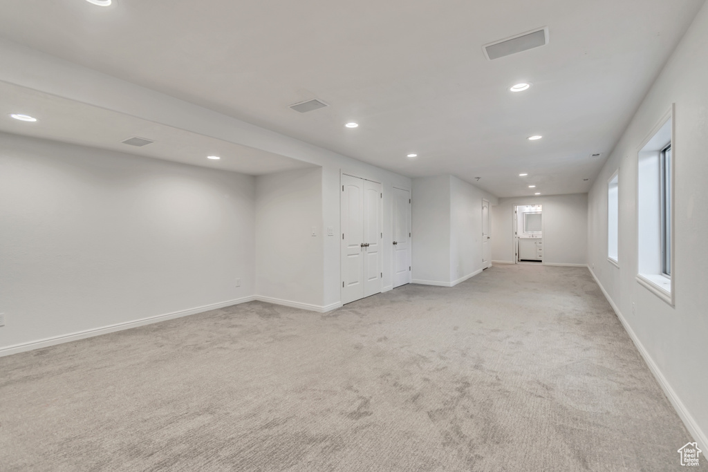 Unfurnished room with recessed lighting and light colored carpet