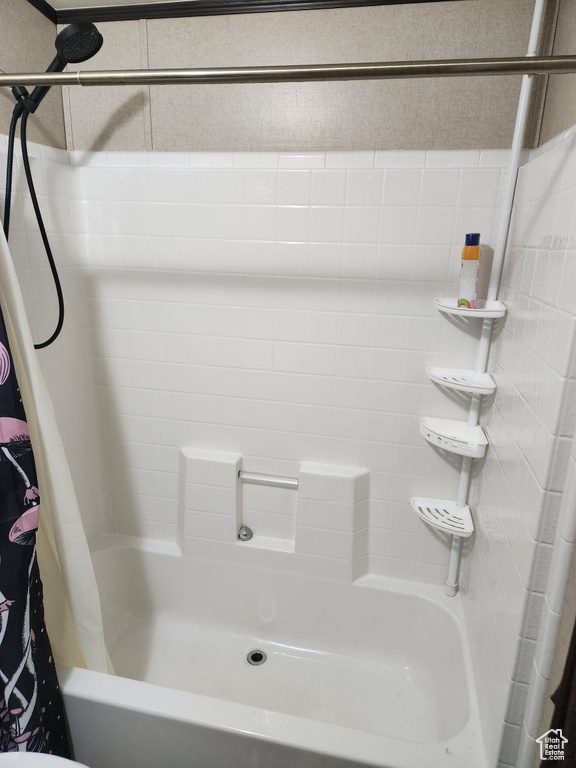 Full bath featuring shower / bathtub combination with curtain
