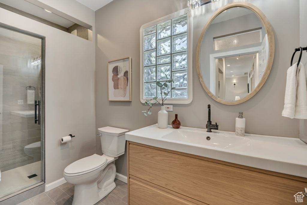 Bathroom with vanity and a stall shower