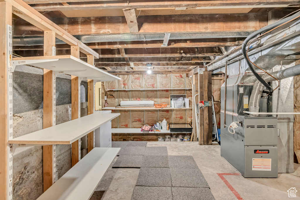 Unfinished below grade area with heating unit