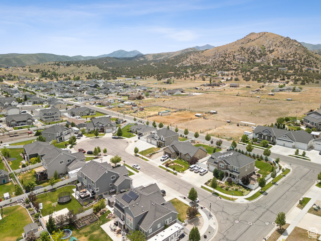 Aerial view of property\\\'s location featuring nearby suburban area and a mountainous background