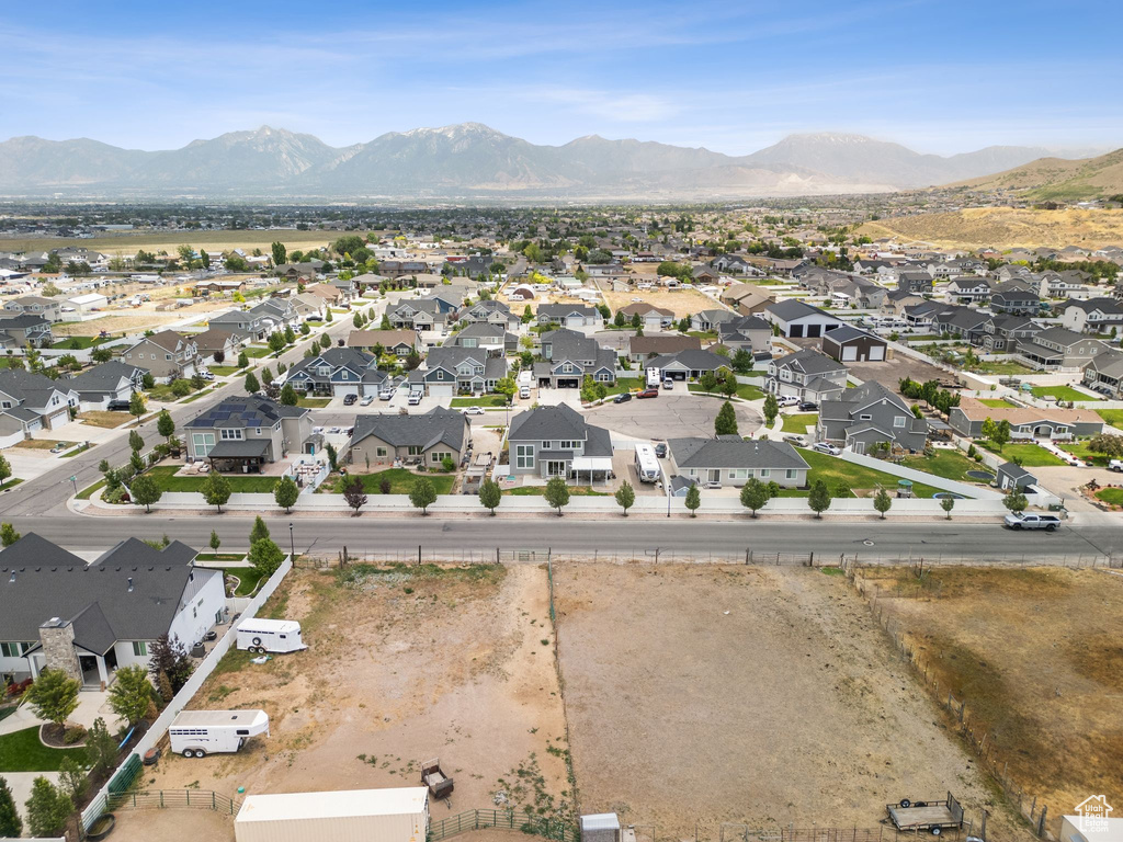 Aerial perspective of suburban area featuring a mountain backdrop