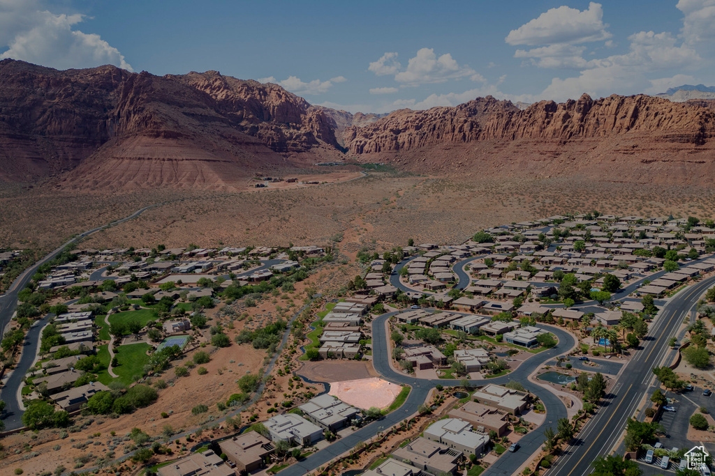 View of property location with mountains and nearby suburban area