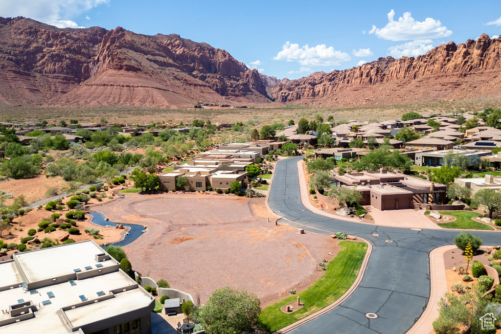 View of mountain backdrop featuring nearby suburban area