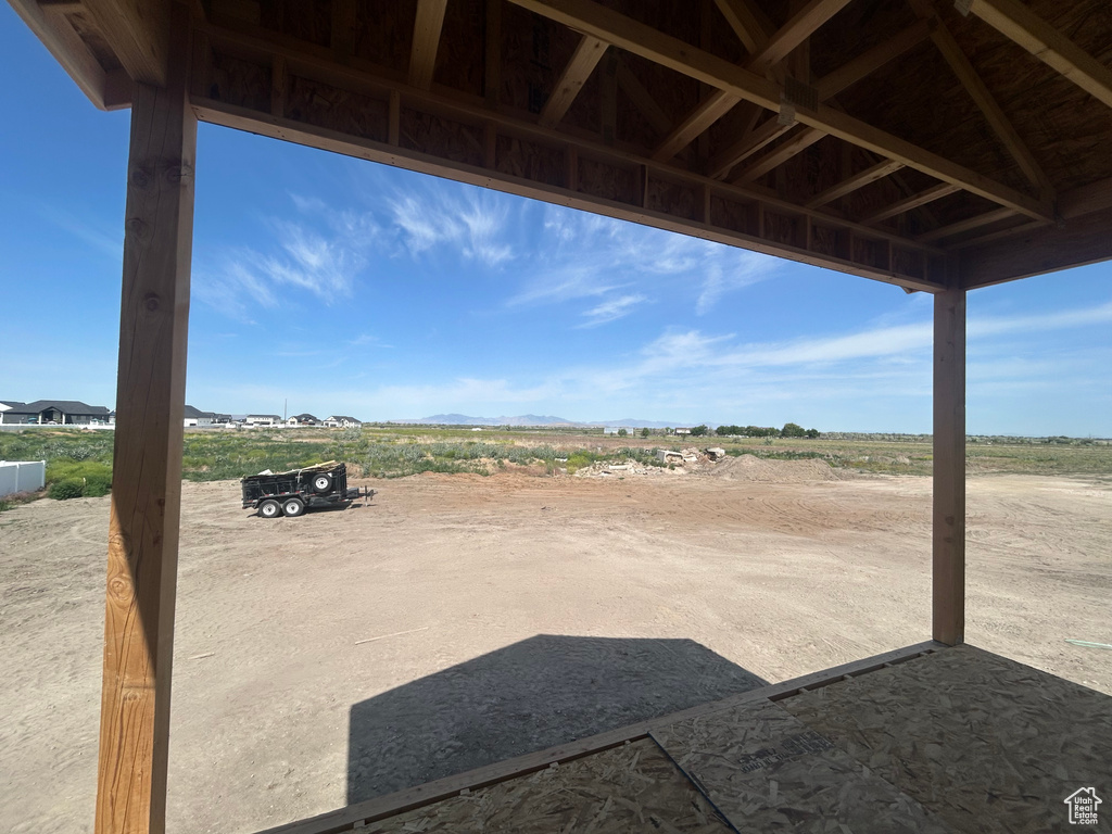 View of patio / terrace with a mountain view and a view of countryside