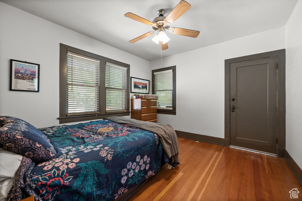 Bedroom with wood finished floors and a ceiling fan
