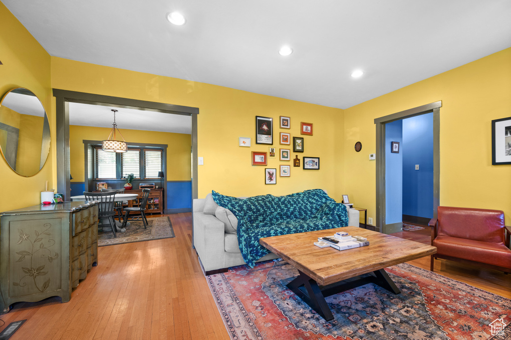 Living room featuring light wood-type flooring and recessed lighting