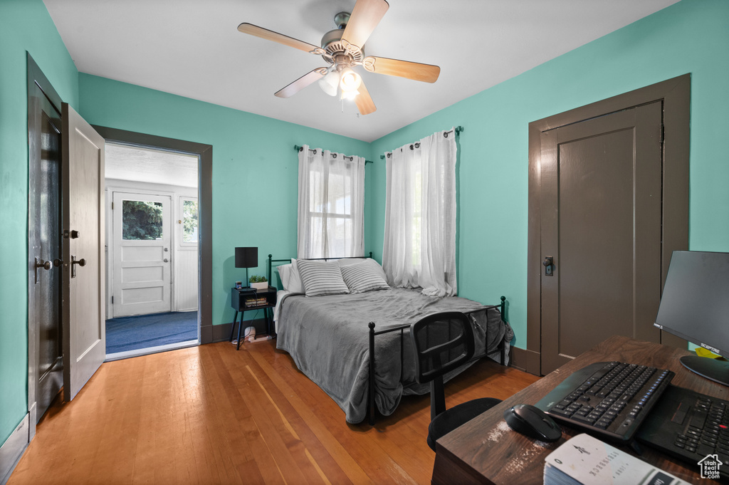 Bedroom with light wood finished floors and ceiling fan
