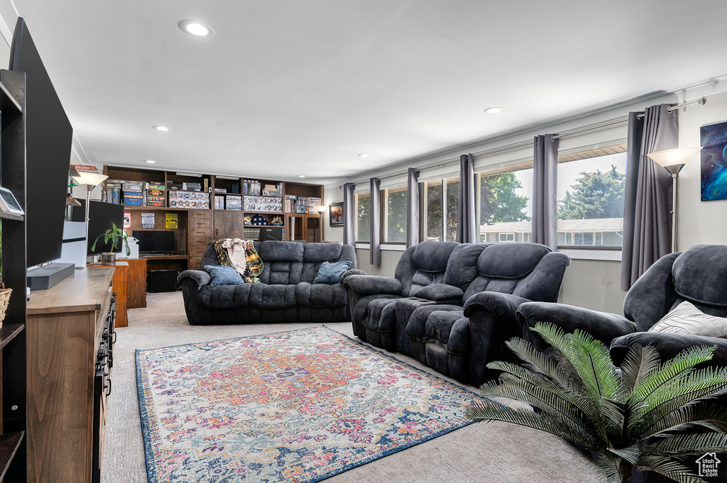 Living room featuring light colored carpet and recessed lighting