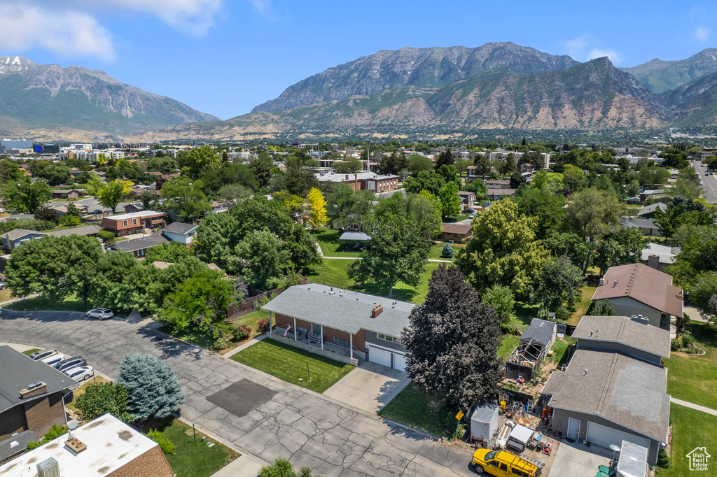 Aerial perspective of suburban area featuring a mountainous background