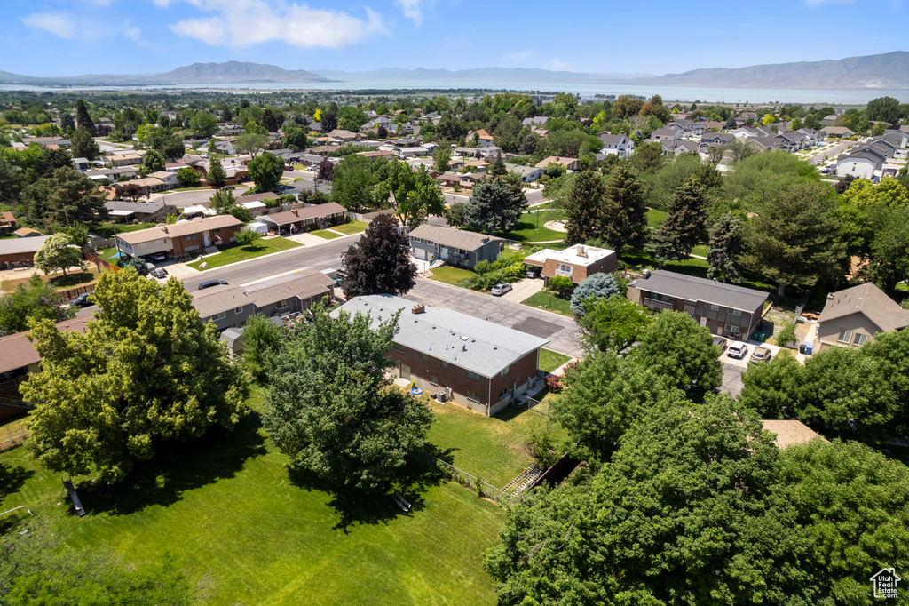 Aerial perspective of suburban area featuring a mountain backdrop