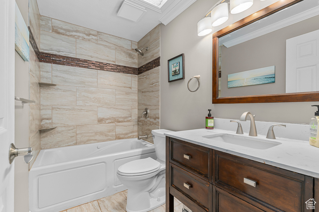 Full bathroom with vanity,  shower combination, and ornamental molding