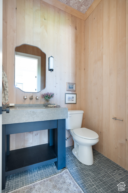 Bathroom with wooden walls and vanity