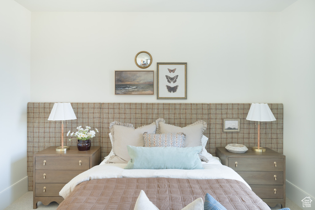 Bedroom with baseboards and carpet floors