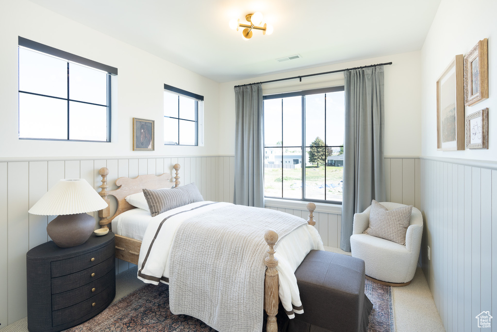 Bedroom with a wainscoted wall