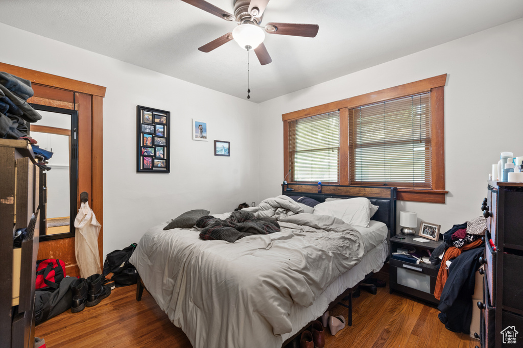 Bedroom featuring wood finished floors and a ceiling fan
