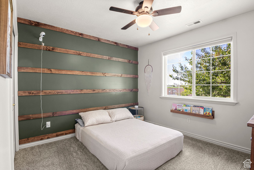 Bedroom featuring carpet flooring and a ceiling fan