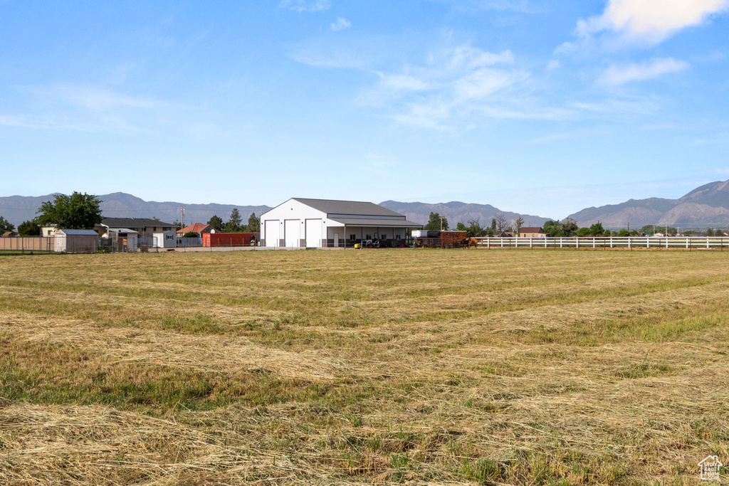 View of yard with a mountain view and a rural view