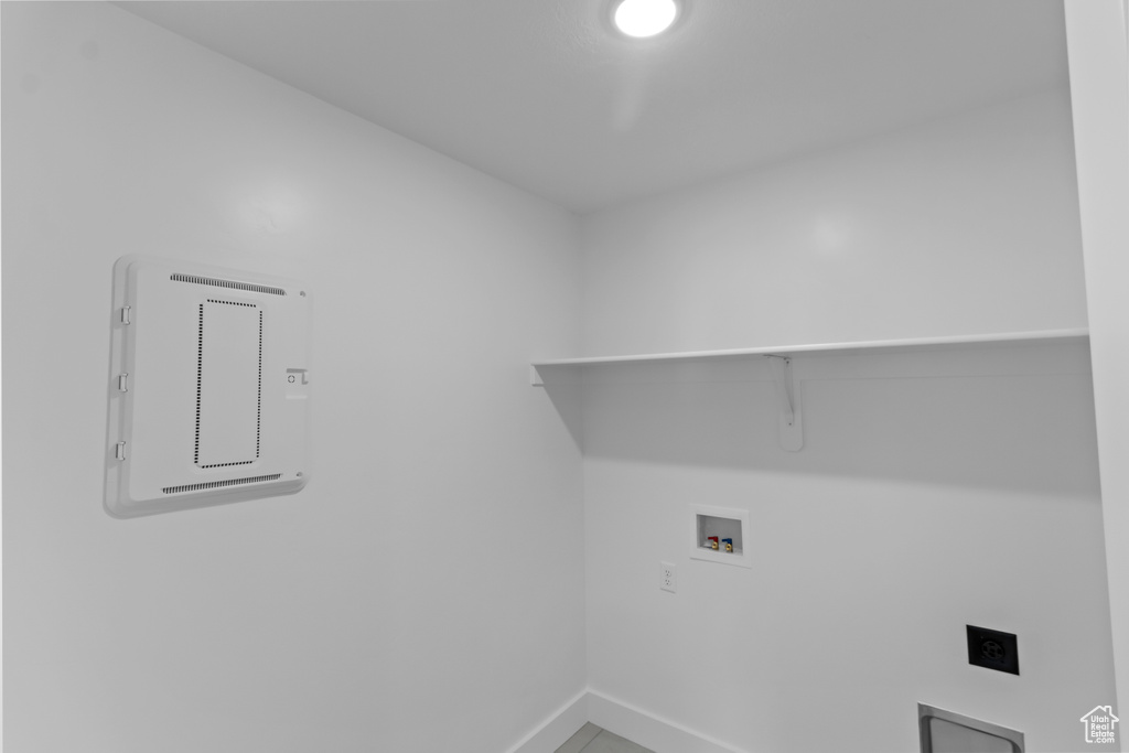 Washroom featuring hookup for a washing machine and baseboards