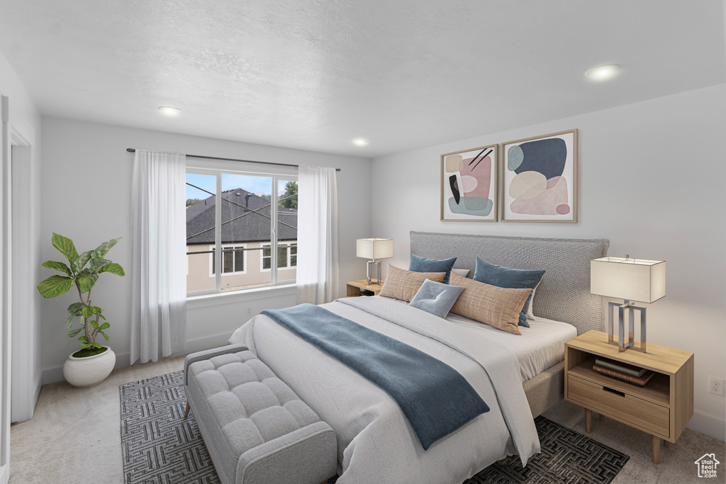 Bedroom featuring light carpet and recessed lighting