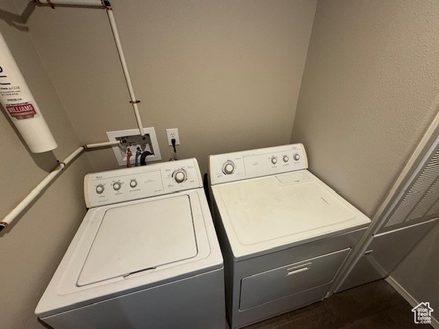 Washroom featuring independent washer and dryer