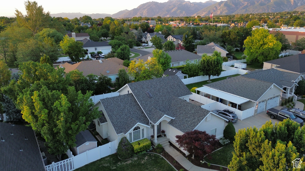 Aerial perspective of suburban area featuring a mountainous background