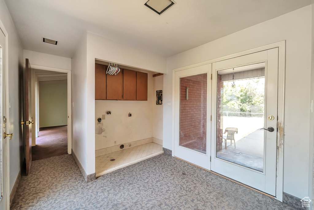 Doorway featuring baseboards