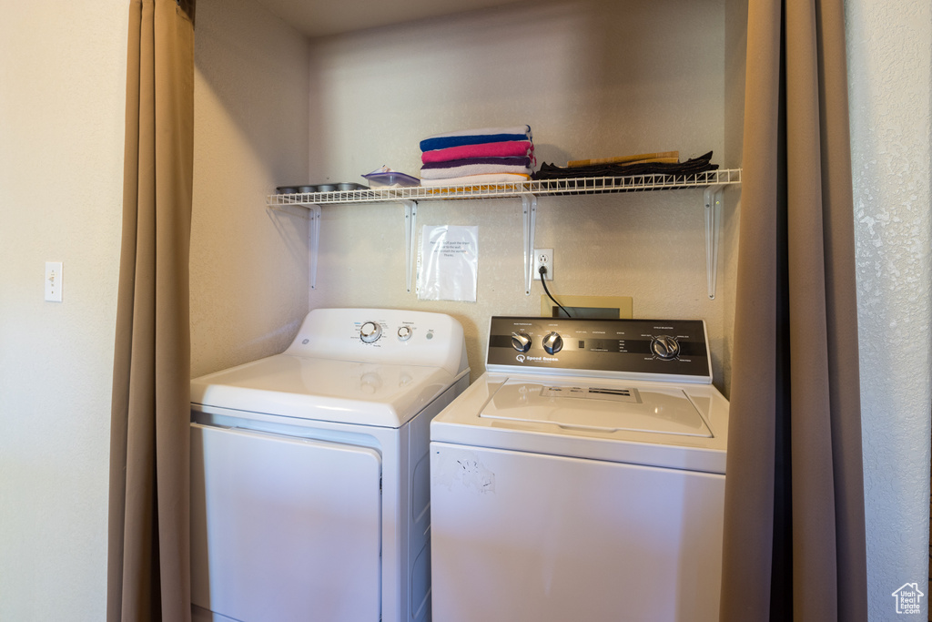 Laundry room featuring washing machine and clothes dryer