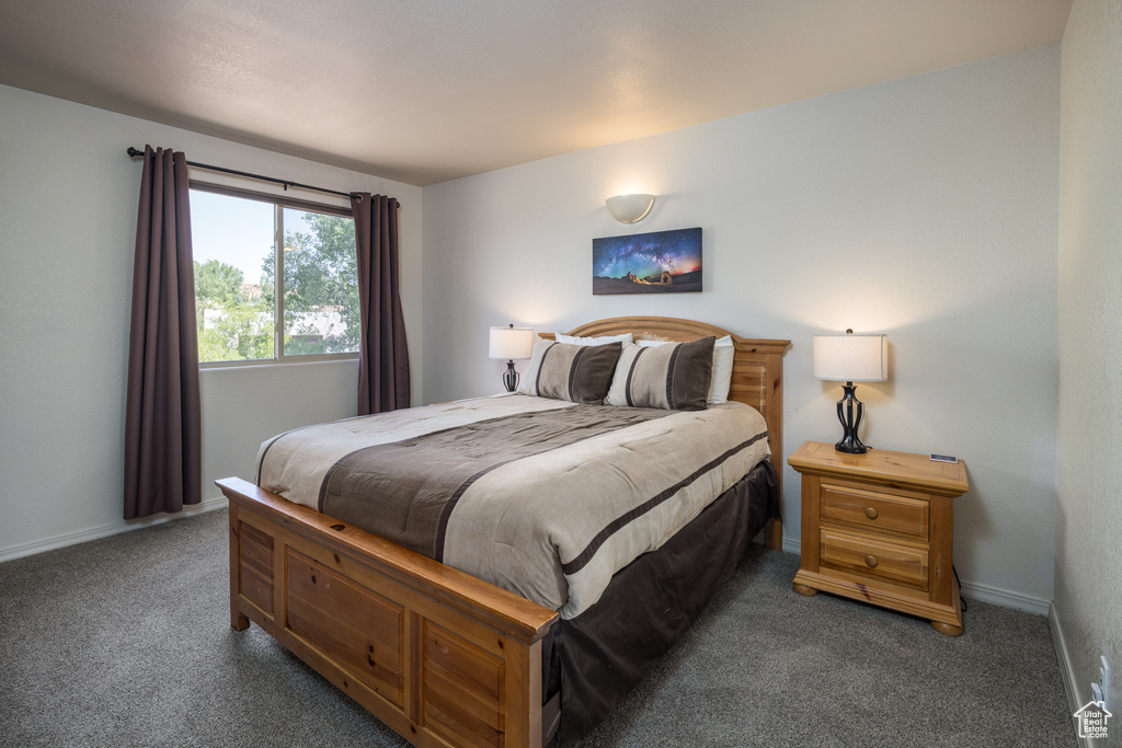Carpeted bedroom with baseboards