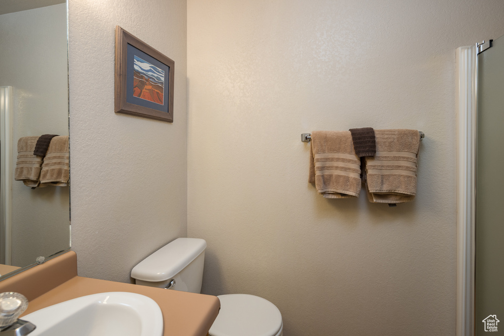 Bathroom with toilet and vanity