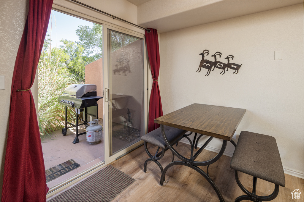 Dining space featuring wood finished floors and baseboards