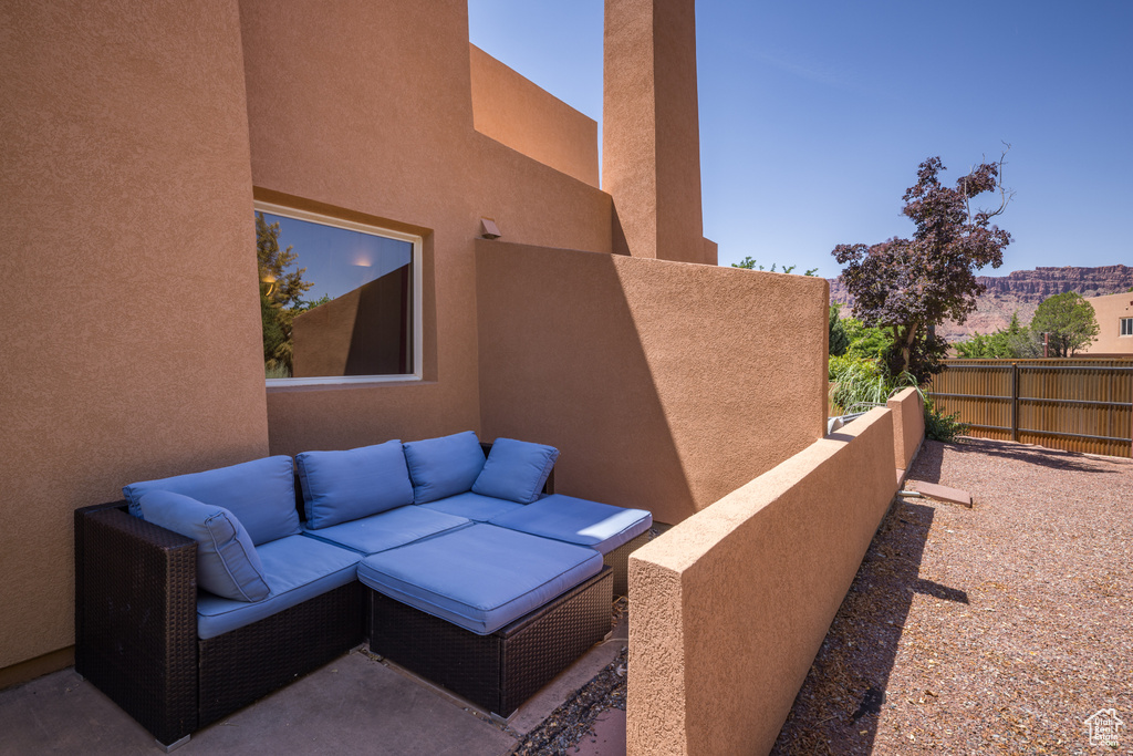 View of patio with an outdoor hangout area