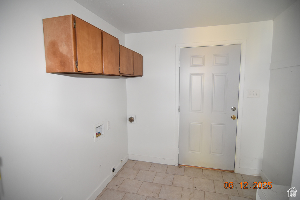 Laundry room with cabinet space and hookup for a washing machine