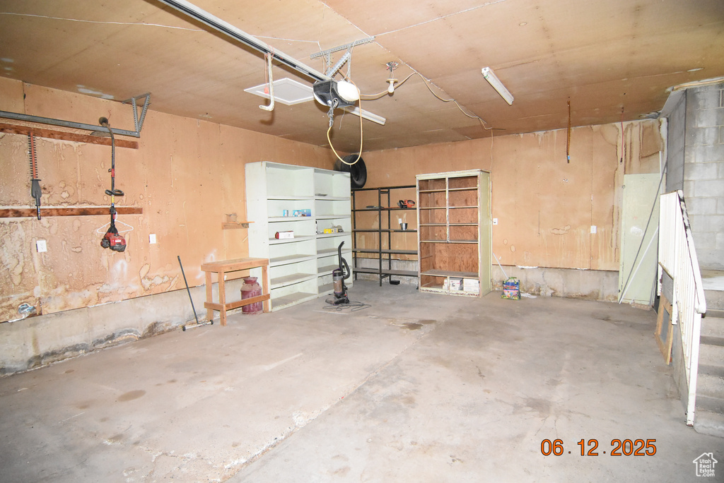 Garage featuring a garage door opener