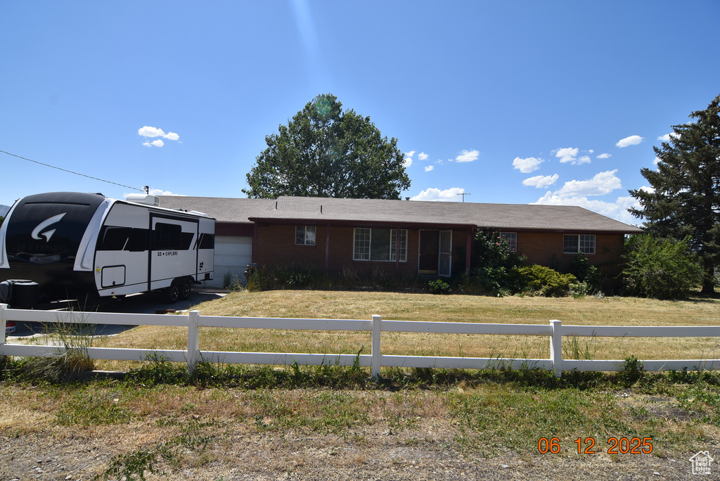 Ranch-style home featuring an attached garage