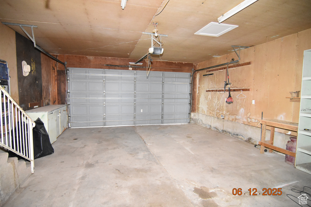 Garage featuring a garage door opener