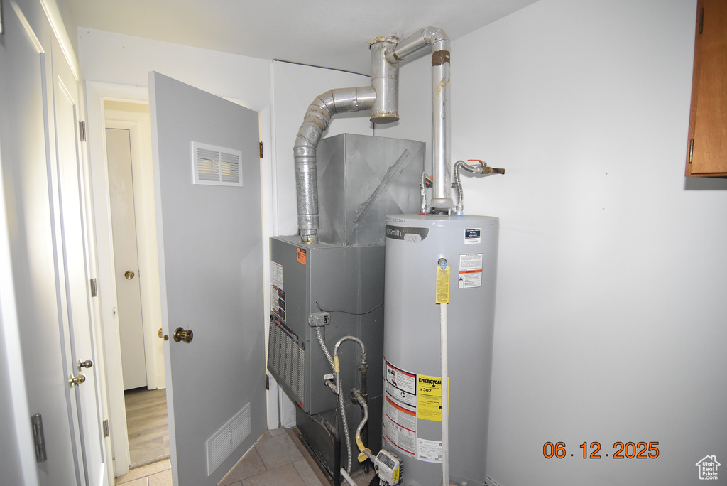 Utility room with gas water heater