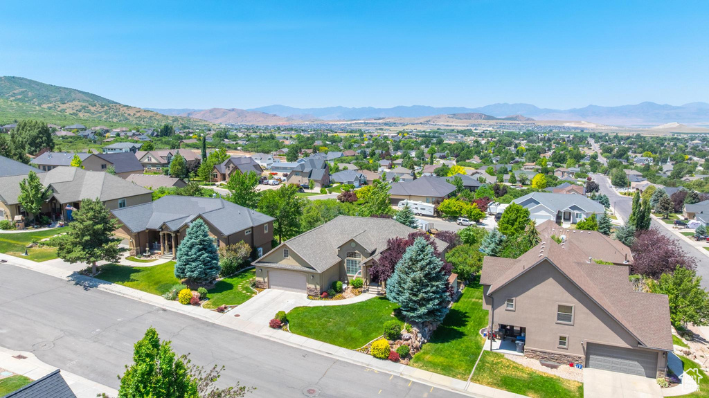 Aerial view of residential area featuring a mountain backdrop
