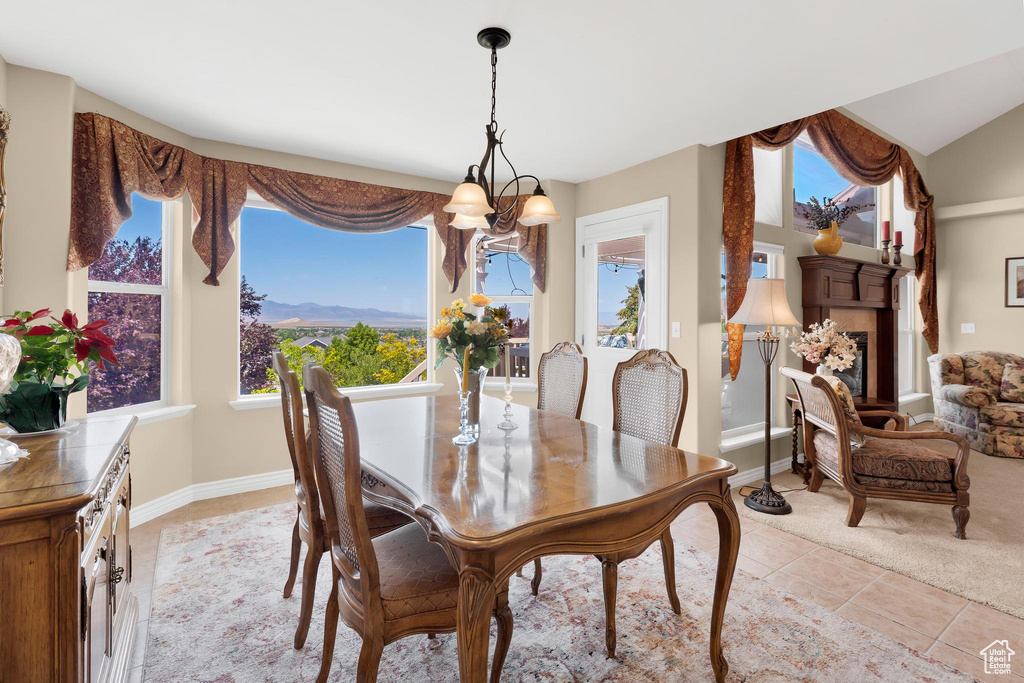 Dining area featuring a chandelier and light tile patterned floors
