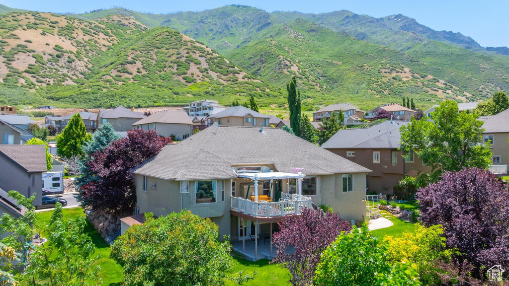 View of mountain background featuring nearby suburban area